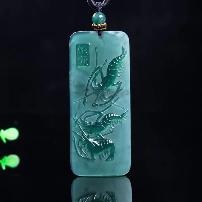 Hand-carved blue water ice type A-grade natural jadeite lobster pendant.