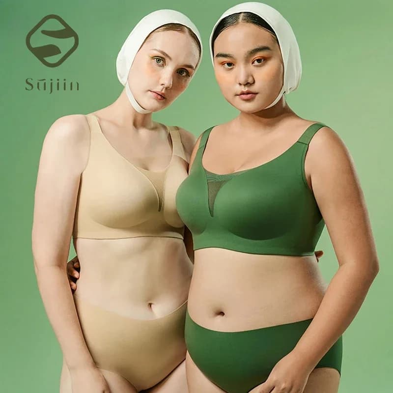 Two women wearing SUJIIN plus size seamless wireless bras in beige and green.