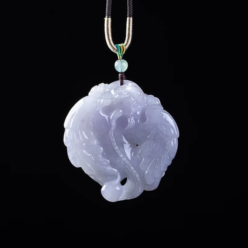 Hand-carved violet Burmese A-grade jadeite Ruyi Pixiu pendant on a black cord.