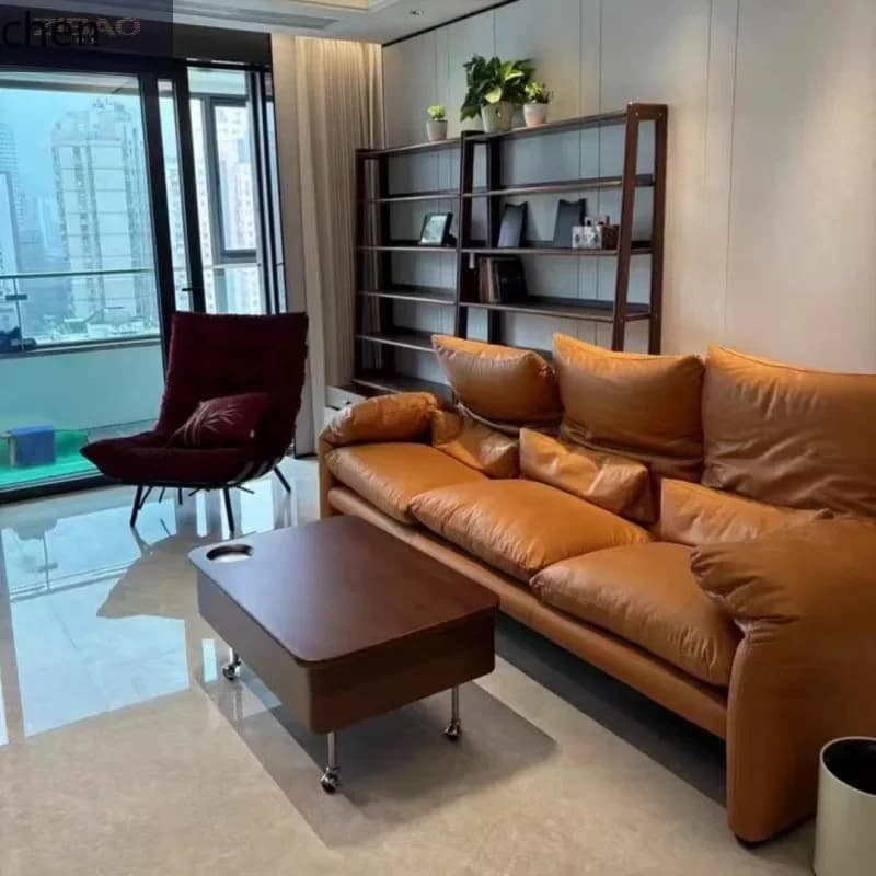 A dark wood lift-top coffee table on wheels in a modern living room setting.