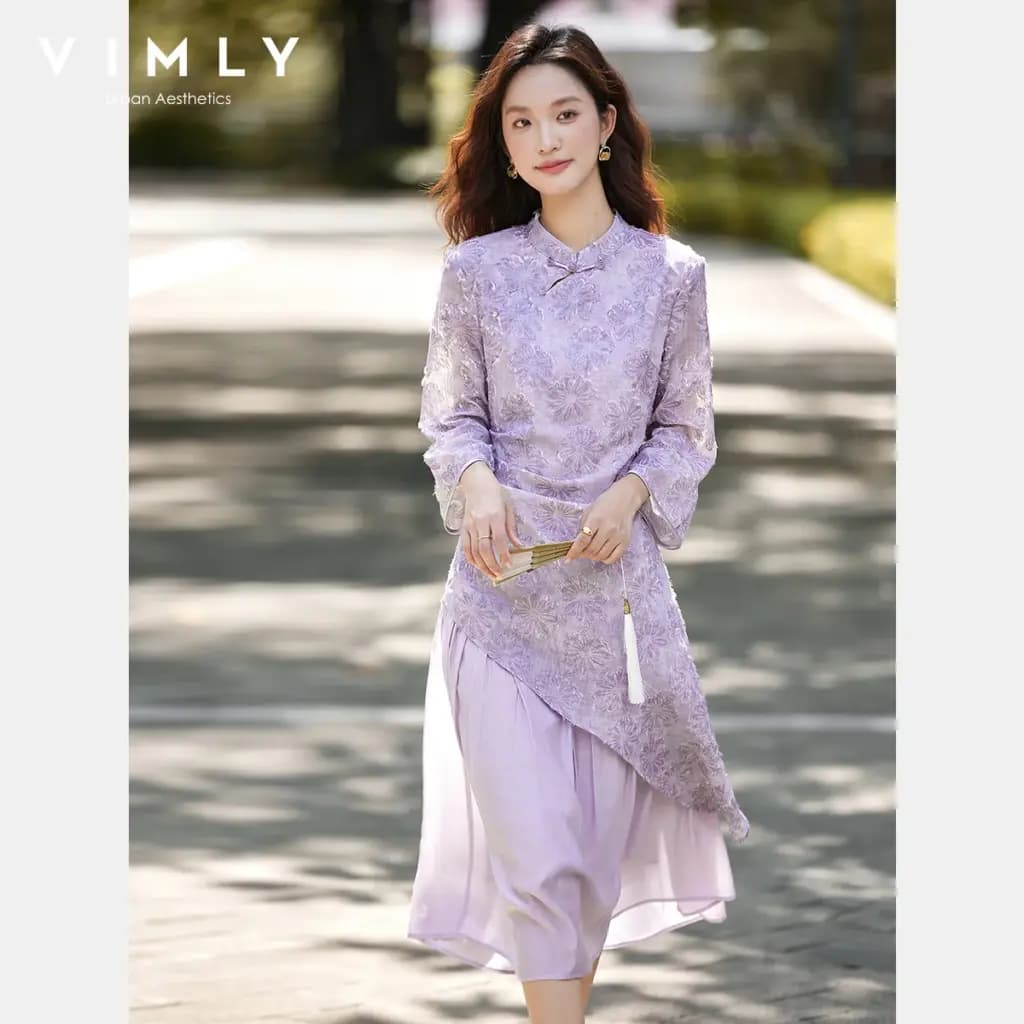 Woman wearing a VIMLY purple embroidered Chinese style midi dress with long sleeves.